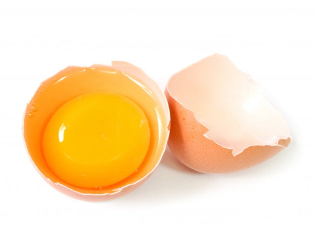 raw egg tear into half with yolk albumin 45096 197