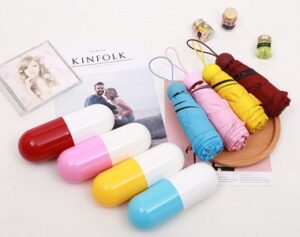 Folding umbrella capsule design for women
